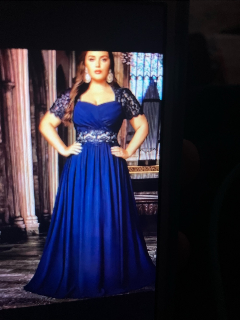 New plus Navy blue dress light reflects the dress and it shows lighter